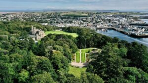 An aerial view of Lews Castle with Stornoway in the background