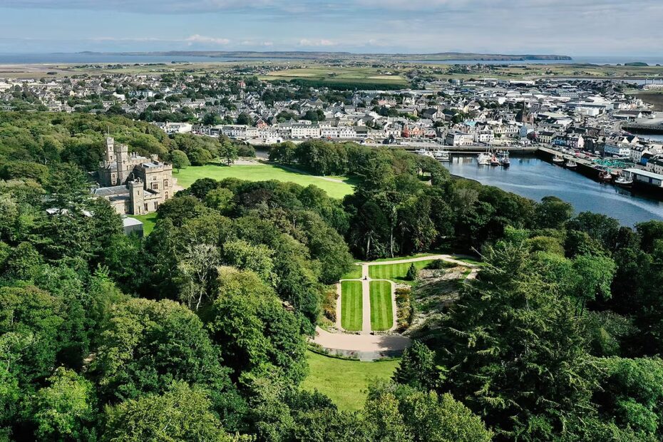 An aerial view of Lews Castle with Stornoway in the background